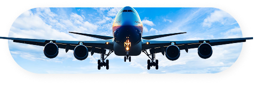 Commercial airplane flying through blue skies with clouds